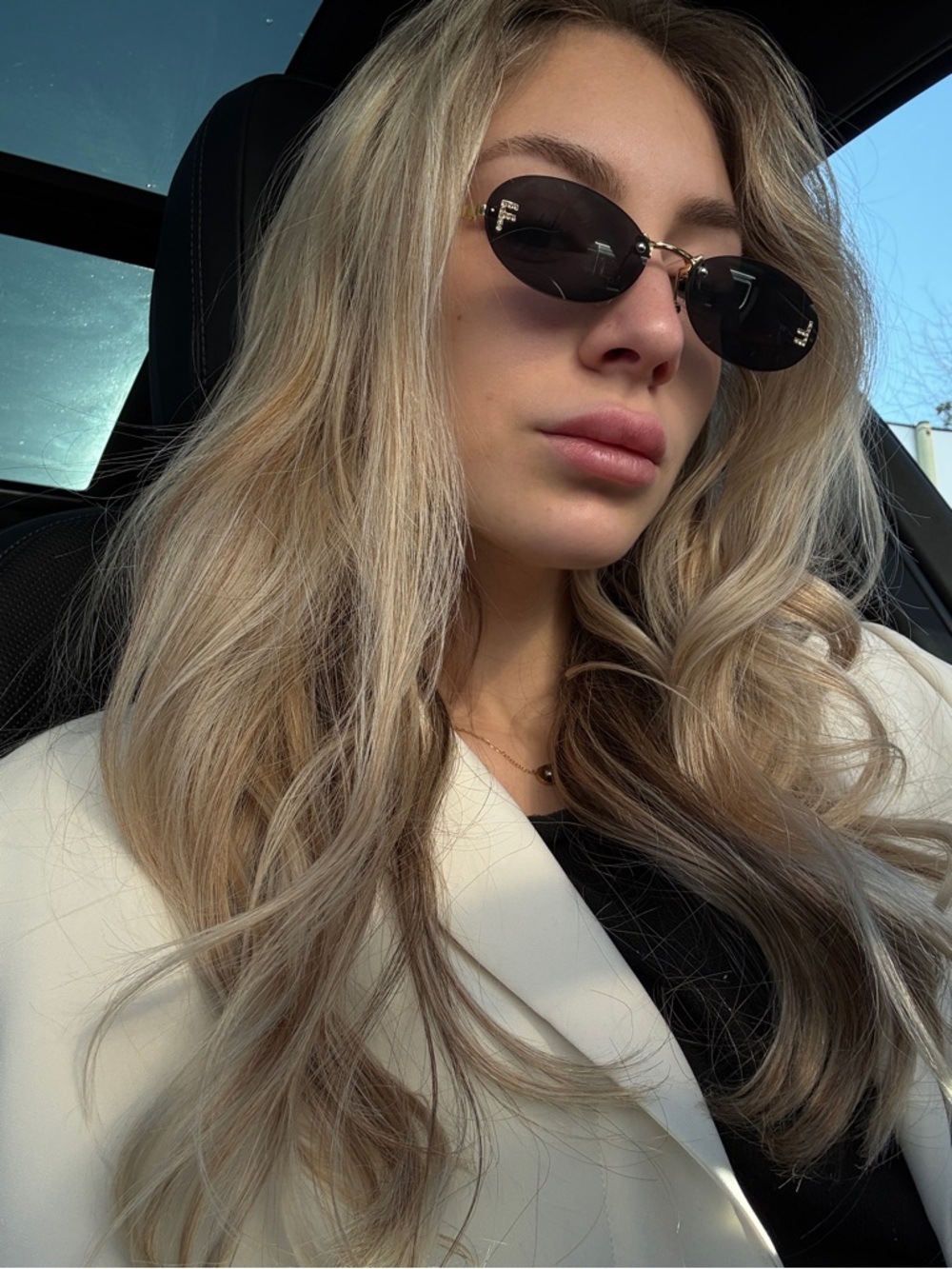 Oval Black Sunglasses with Gold Accents